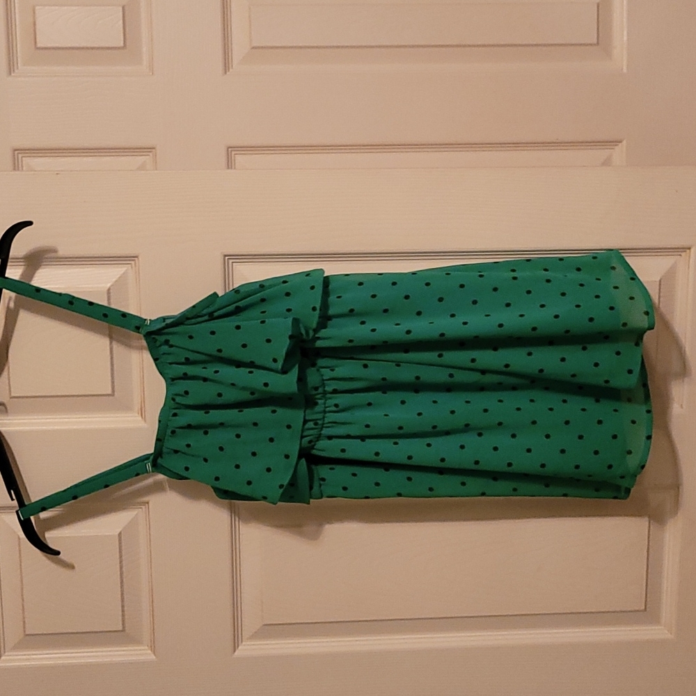 Green and black polka dot top